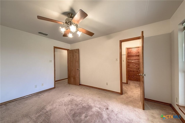 2721 Barton Hill Dr, Bulverde, TX 78163 - unfurnished bedroom with light colored carpet, baseboards, and ceiling fan
