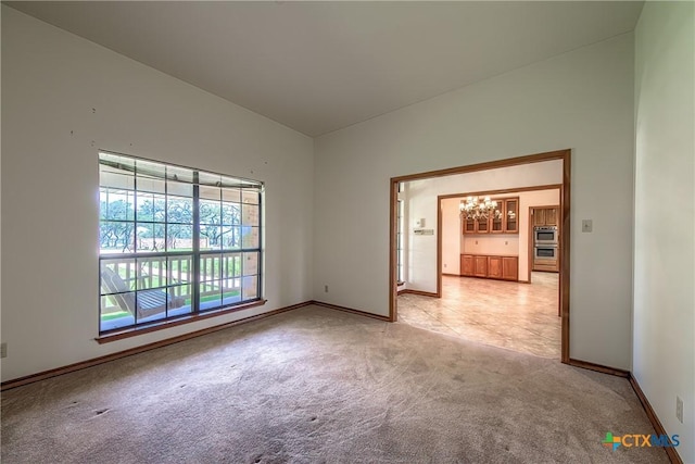 2721 Barton Hill Dr, Bulverde, TX 78163 - empty room featuring a chandelier, light carpet, and baseboards