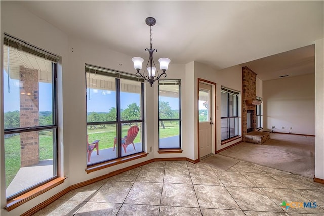 2721 Barton Hill Dr, Bulverde, TX 78163 - doorway featuring plenty of natural light, a chandelier, light tile patterned floors, and baseboards