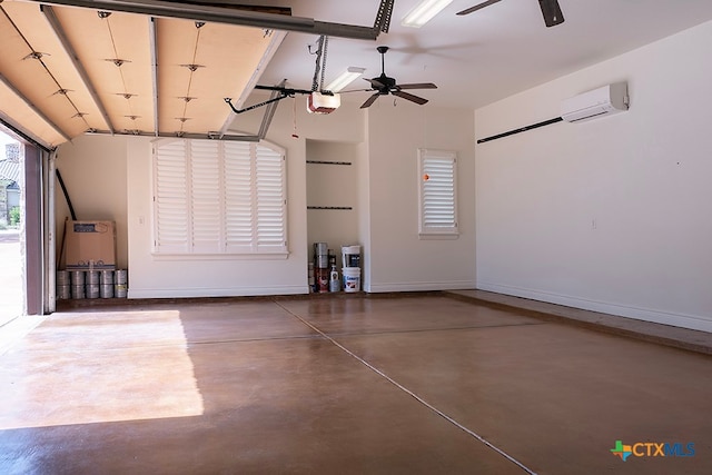 garage featuring a wall mounted AC, ceiling fan, and a garage door opener