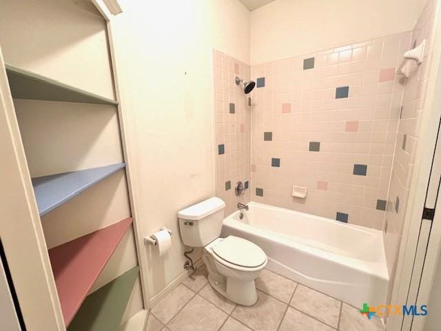bathroom with toilet, tile patterned floors, and bathing tub / shower combination