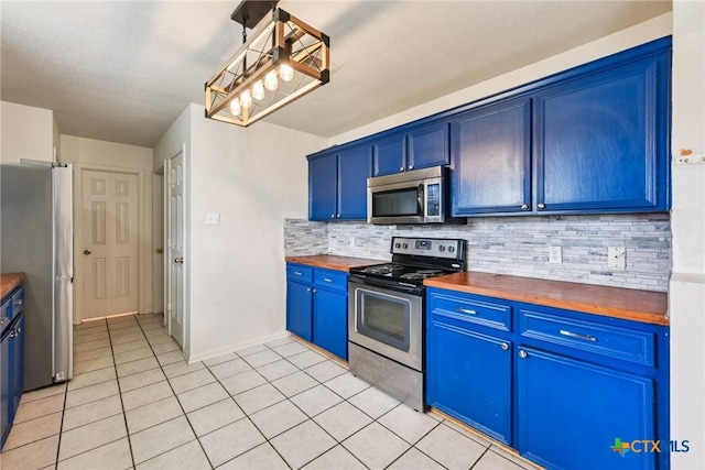 2204 Mikulec Dr, Killeen, TX 76542 - kitchen featuring stainless steel appliances, butcher block countertops, blue cabinets, tasteful backsplash, and light tile patterned flooring