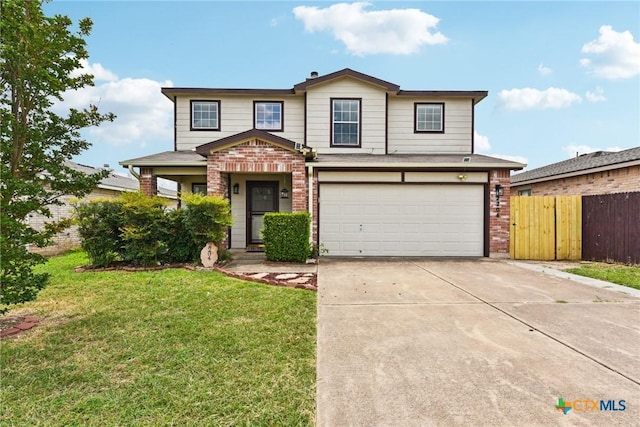 2204 Mikulec Dr, Killeen, TX 76542 - view of front facade featuring brick siding, an attached garage, and driveway