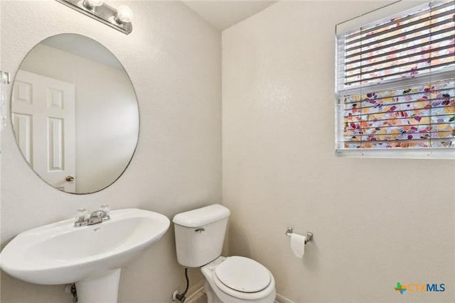 2204 Mikulec Dr, Killeen, TX 76542 - bathroom with a sink, toilet, and baseboards