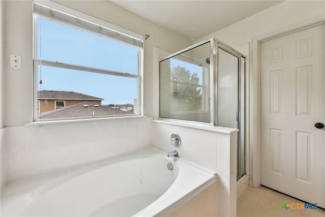 2204 Mikulec Dr, Killeen, TX 76542 - bathroom featuring plenty of natural light, a bath, and a stall shower