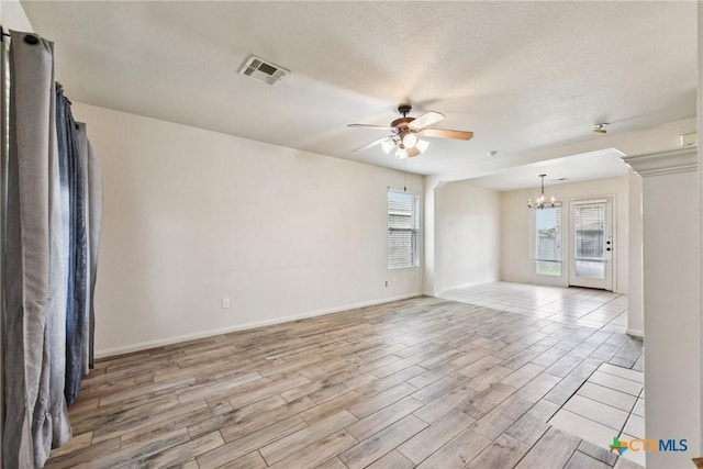 2204 Mikulec Dr, Killeen, TX 76542 - unfurnished room with a chandelier, ceiling fan, healthy amount of natural light, and light wood finished floors
