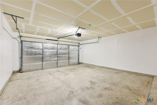 2204 Mikulec Dr, Killeen, TX 76542 - garage featuring a garage door opener and baseboards