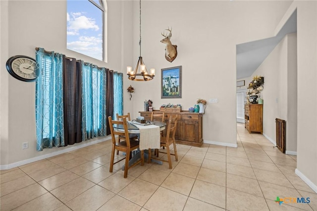 1901 Deer Field Way, Harker Heights, TX 76548 - dining area featuring a chandelier, light tile patterned floors, and a towering ceiling