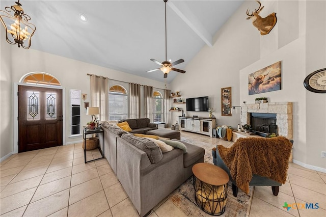 1901 Deer Field Way, Harker Heights, TX 76548 - living area with high vaulted ceiling, light tile patterned floors, a chandelier, a fireplace, and beamed ceiling