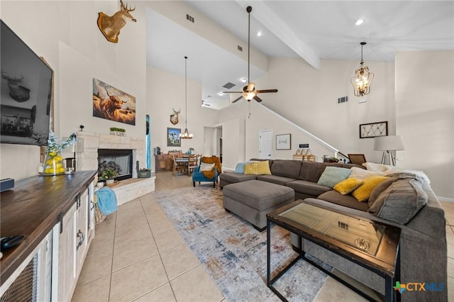 1901 Deer Field Way, Harker Heights, TX 76548 - living room featuring a stone fireplace, high vaulted ceiling, ceiling fan, light tile patterned flooring, and a chandelier