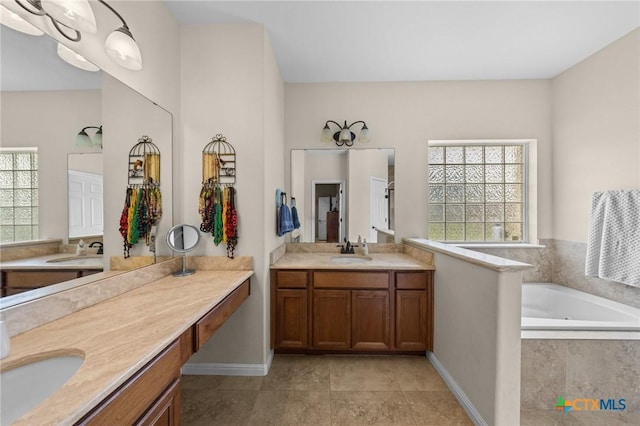 1901 Deer Field Way, Harker Heights, TX 76548 - full bath featuring healthy amount of natural light, two vanities, and a garden tub