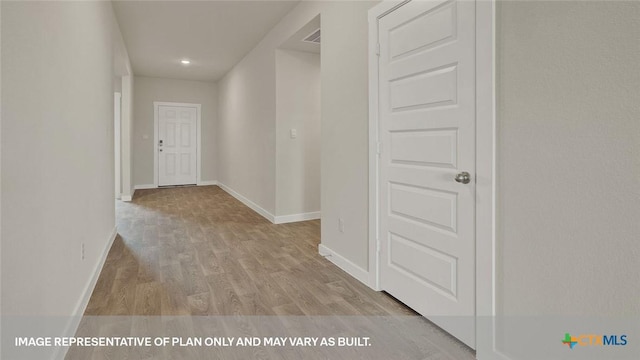 575 Radley Rd, Lockhart, TX 78644 - hallway featuring wood finished floors and baseboards