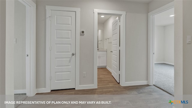 corridor featuring light hardwood / wood-style flooring