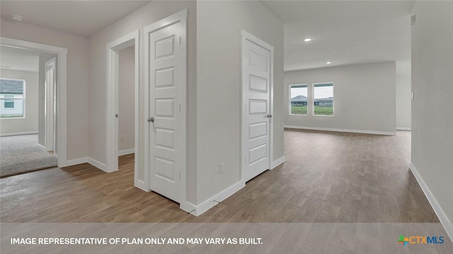 575 Radley Rd, Lockhart, TX 78644 - hallway with wood finished floors, baseboards, and recessed lighting