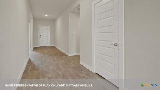 hallway featuring light hardwood / wood-style flooring