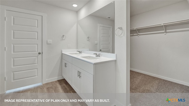 bathroom with vanity and wood-type flooring