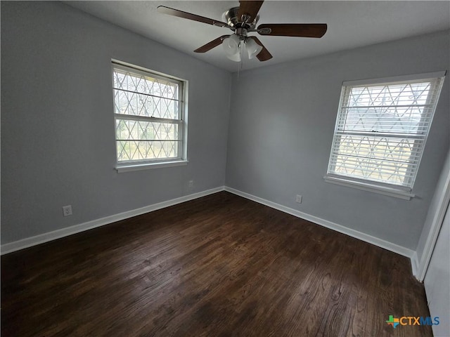 unfurnished room featuring ceiling fan and dark hardwood / wood-style floors