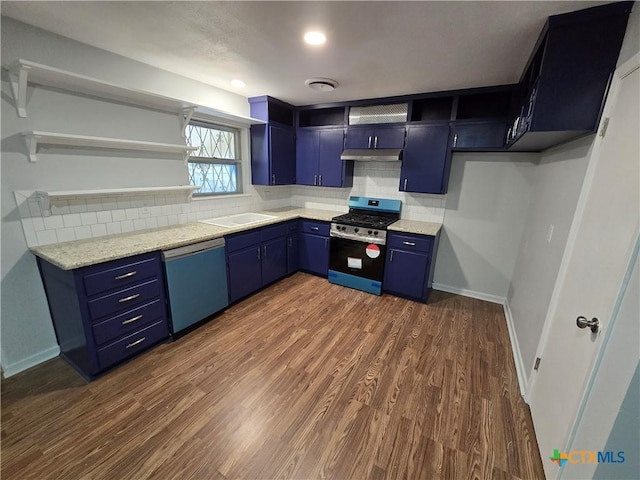 kitchen featuring stainless steel appliances, tasteful backsplash, dark wood-type flooring, blue cabinets, and light stone countertops