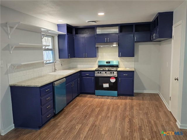 kitchen featuring dishwasher, gas range, blue cabinetry, open shelves, and a sink