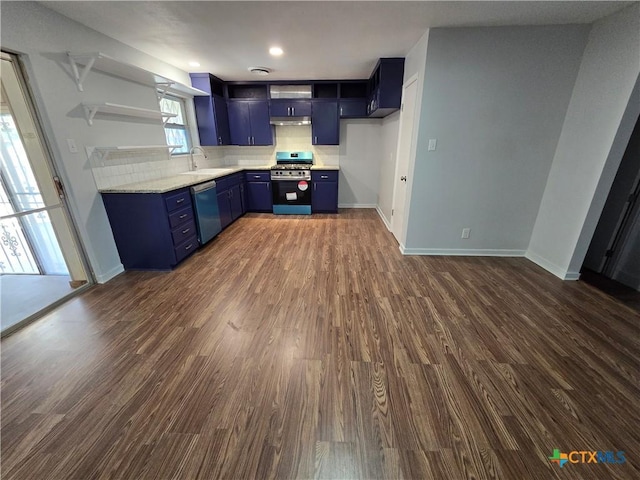 kitchen with blue cabinets, dark wood finished floors, stainless steel appliances, and a sink