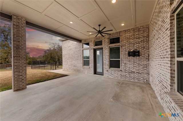 patio terrace at dusk with ceiling fan