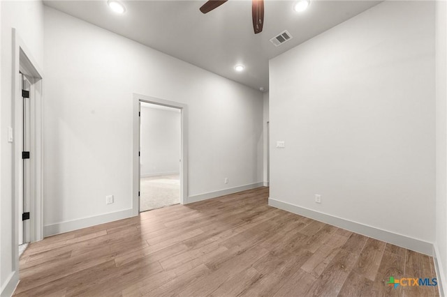 spare room featuring ceiling fan and light wood-type flooring