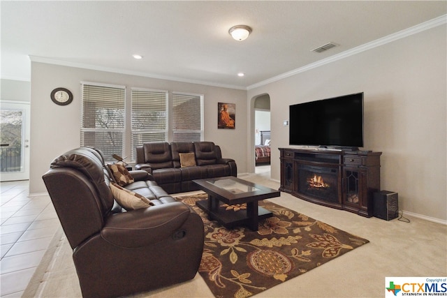 living room featuring light tile patterned flooring and crown molding