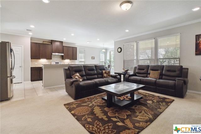 carpeted living room with ornamental molding