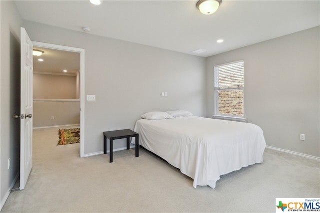 bedroom featuring light colored carpet