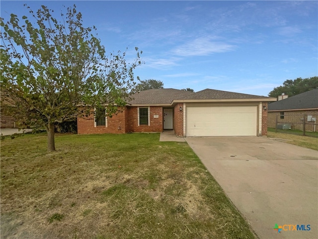 single story home with a garage and a front yard