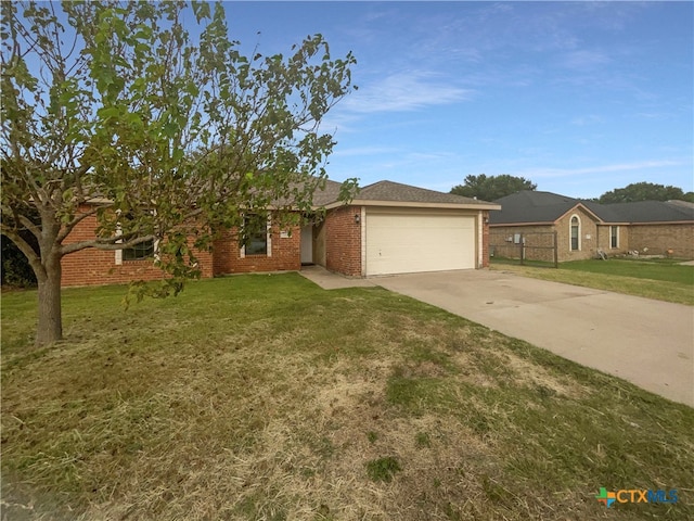 single story home with a garage and a front lawn