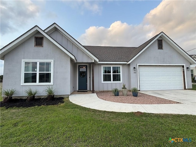 ranch-style home featuring board and batten siding, a front yard, concrete driveway, and a garage