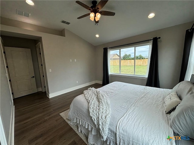 bedroom with dark wood-type flooring, visible vents, recessed lighting, and vaulted ceiling
