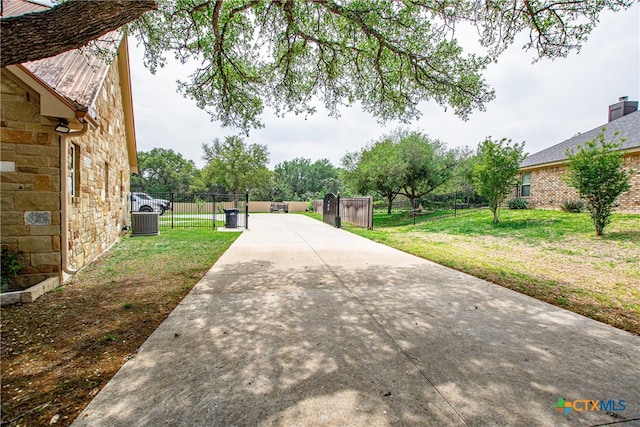 view of property's community with a yard