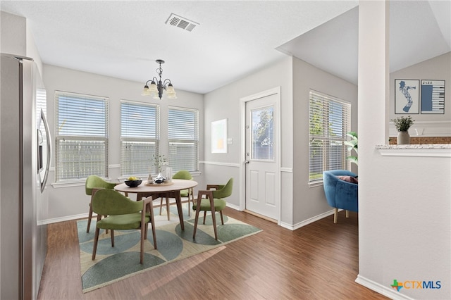 7915 Redbrush, Temple, TX 76502 - dining room with wood finished floors and a chandelier
