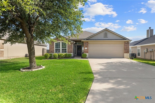 7915 Redbrush, Temple, TX 76502 - ranch-style home featuring brick siding, a garage, concrete driveway, and a front lawn