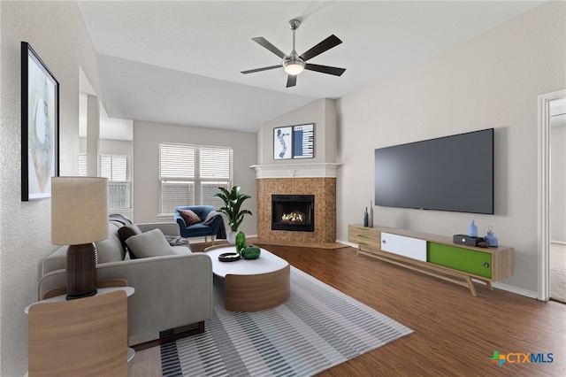 7915 Redbrush, Temple, TX 76502 - living area with wood finished floors, a ceiling fan, vaulted ceiling, and a fireplace with flush hearth