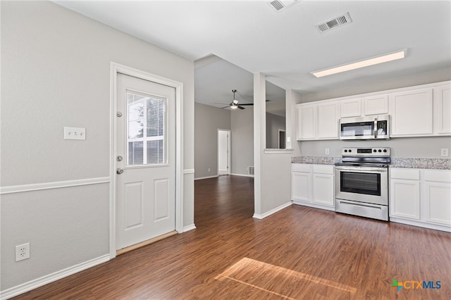 7915 Redbrush, Temple, TX 76502 - kitchen with appliances with stainless steel finishes, dark wood-type flooring, and white cabinets