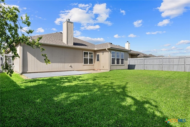 7915 Redbrush, Temple, TX 76502 - rear view of property with a chimney, a patio area, and roof with shingles