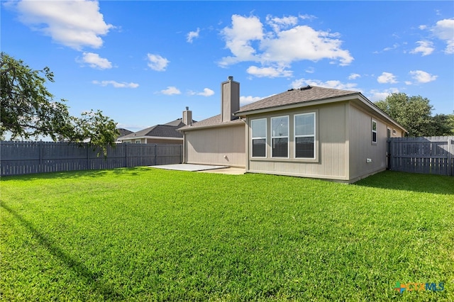 7915 Redbrush, Temple, TX 76502 - back of property featuring a patio, a fenced backyard, roof with shingles, and a chimney