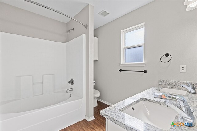 7915 Redbrush, Temple, TX 76502 - full bathroom with shower / bathtub combination, wood finished floors, and double vanity