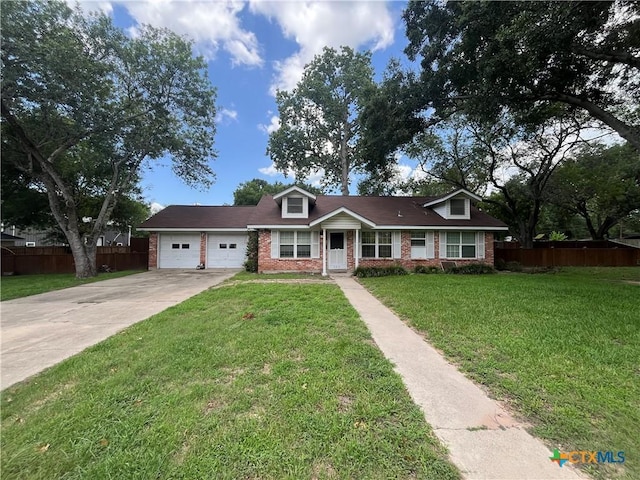306 Angus St, Victoria, TX 77904 - view of front of house with brick siding, driveway, and an attached garage