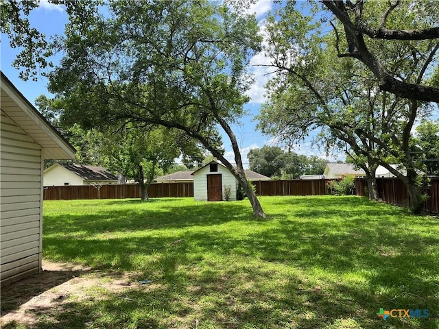 306 Angus St, Victoria, TX 77904 - fenced backyard with a storage shed