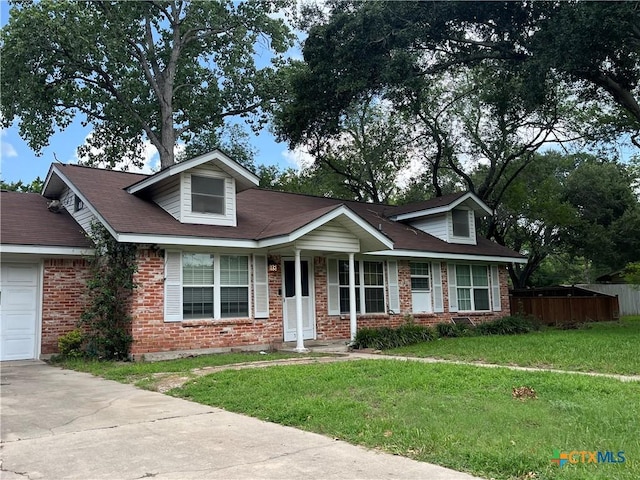 306 Angus St, Victoria, TX 77904 - view of front of home with brick siding, driveway, and an attached garage