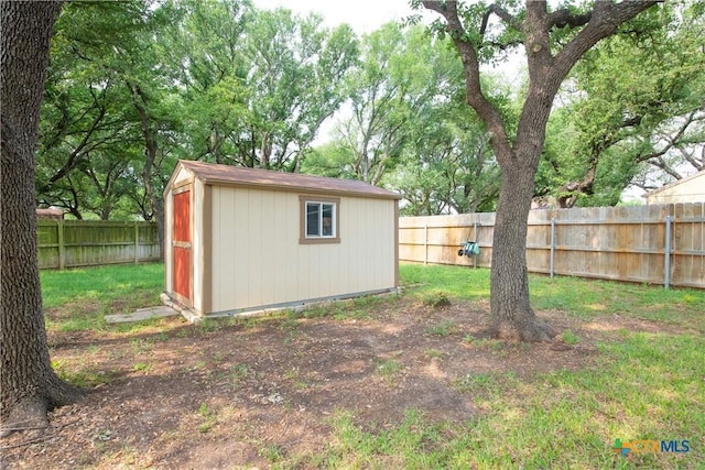 view of shed featuring a fenced backyard