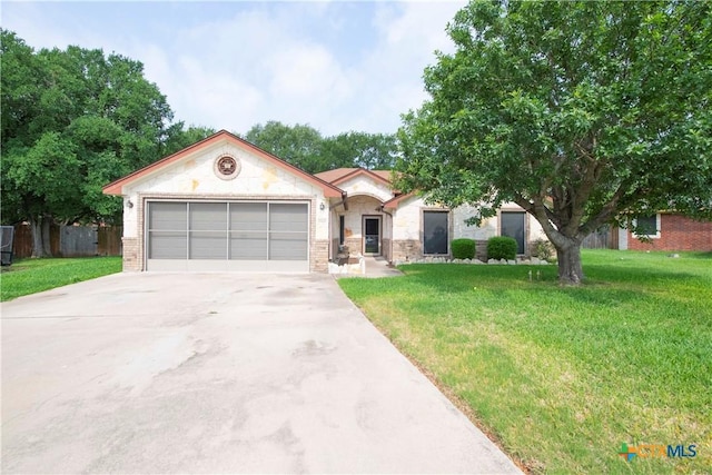 view of front of property with concrete driveway, an attached garage, stone siding, and a front lawn