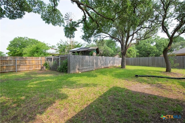 view of yard with a fenced backyard