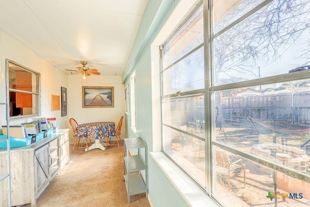 sunroom / solarium with ceiling fan