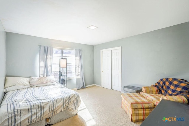 carpeted bedroom with a closet