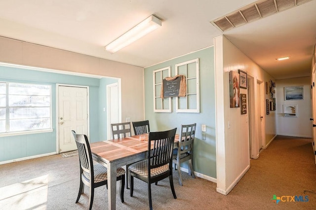 view of carpeted dining area